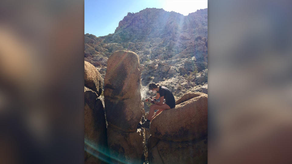 Anna Rood drills samples from a rock that has withstood earthquakes for 50,000 years.