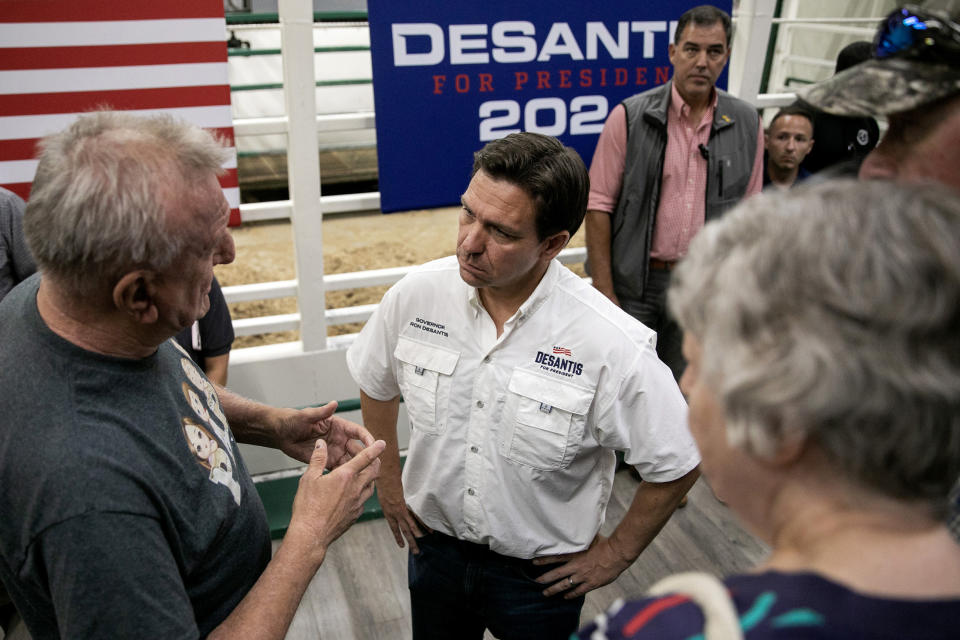 Image: DeSantis meets with voters at a campaign stop at Spanky's South Tama Livestock Auction in Iowa on Saturday. (Maddie McGarvey for NBC News)