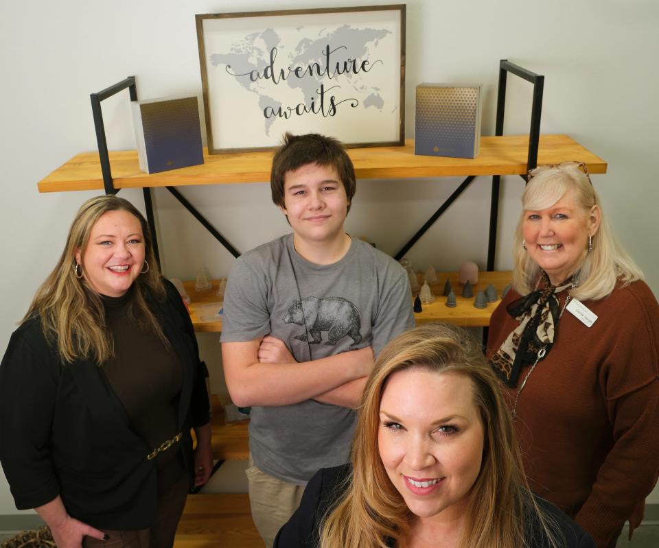Allison Watkins, founder/CEO of Watkins-Conti Products Inc., foreground, is pictured Feb. 24 with from left, Cara Jane Evans, director of AXIS FT; Nash Conti, son; and Connie Hammett, program assistant of AXIS FT.