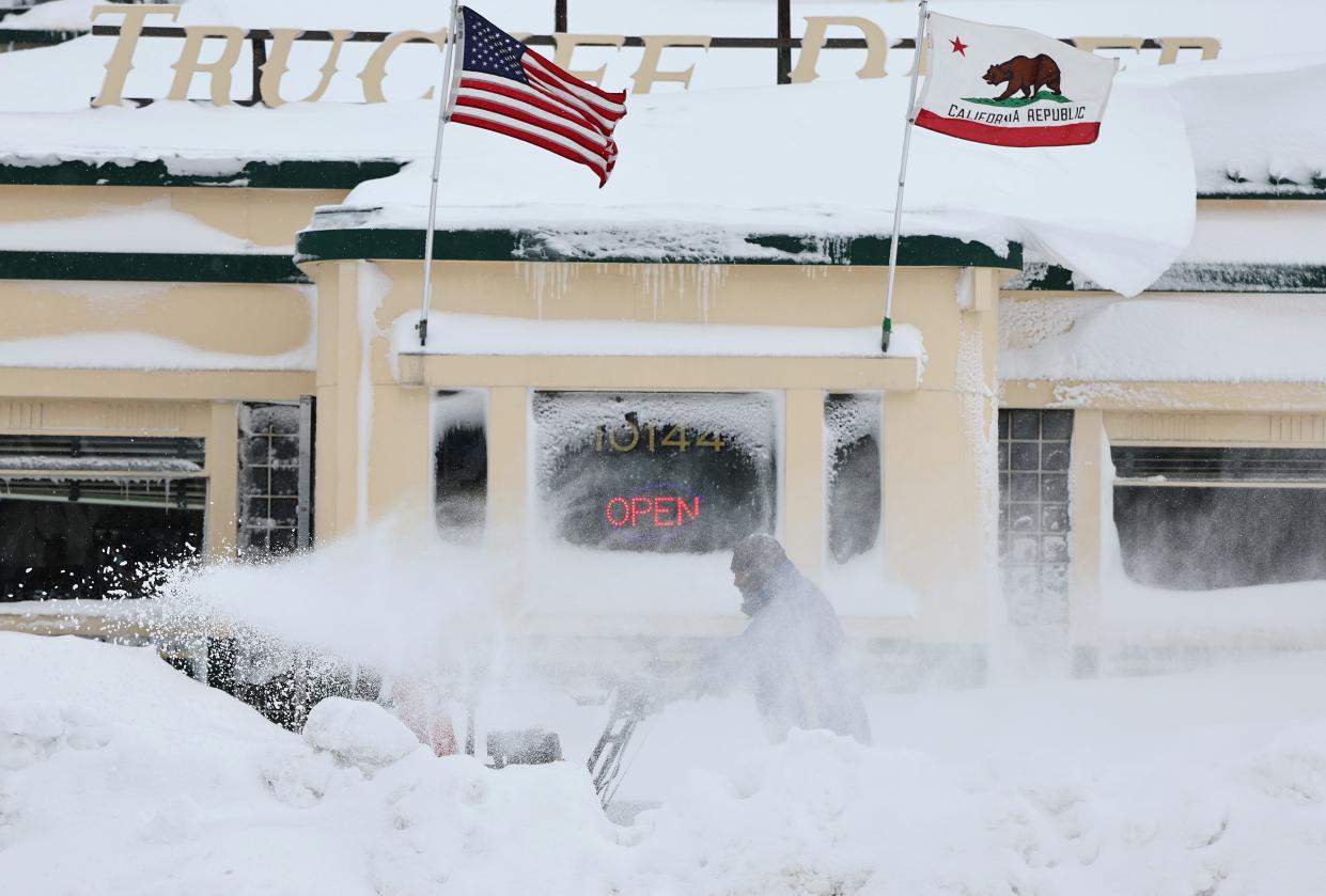 TRUCKEE, CALIFORNIA - MARCH 02: Valentino Perez uses a snowblower in front of a restaurant north of Lake Tahoe during a powerful multiple day winter storm in the Sierra Nevada mountains on March 02, 2024 in Truckee, California. Blizzard warnings were issued with snowfall of up to 12 feet and wind gusts over 100 mph expected in some higher elevation locations. Yosemite National Park is closed and a 50-mile stretch of Interstate 80 was shut down yesterday due to the storm. (Photo by Mario Tama/Getty Images) ORG XMIT: 776114505 ORIG FILE ID: 2053643823
