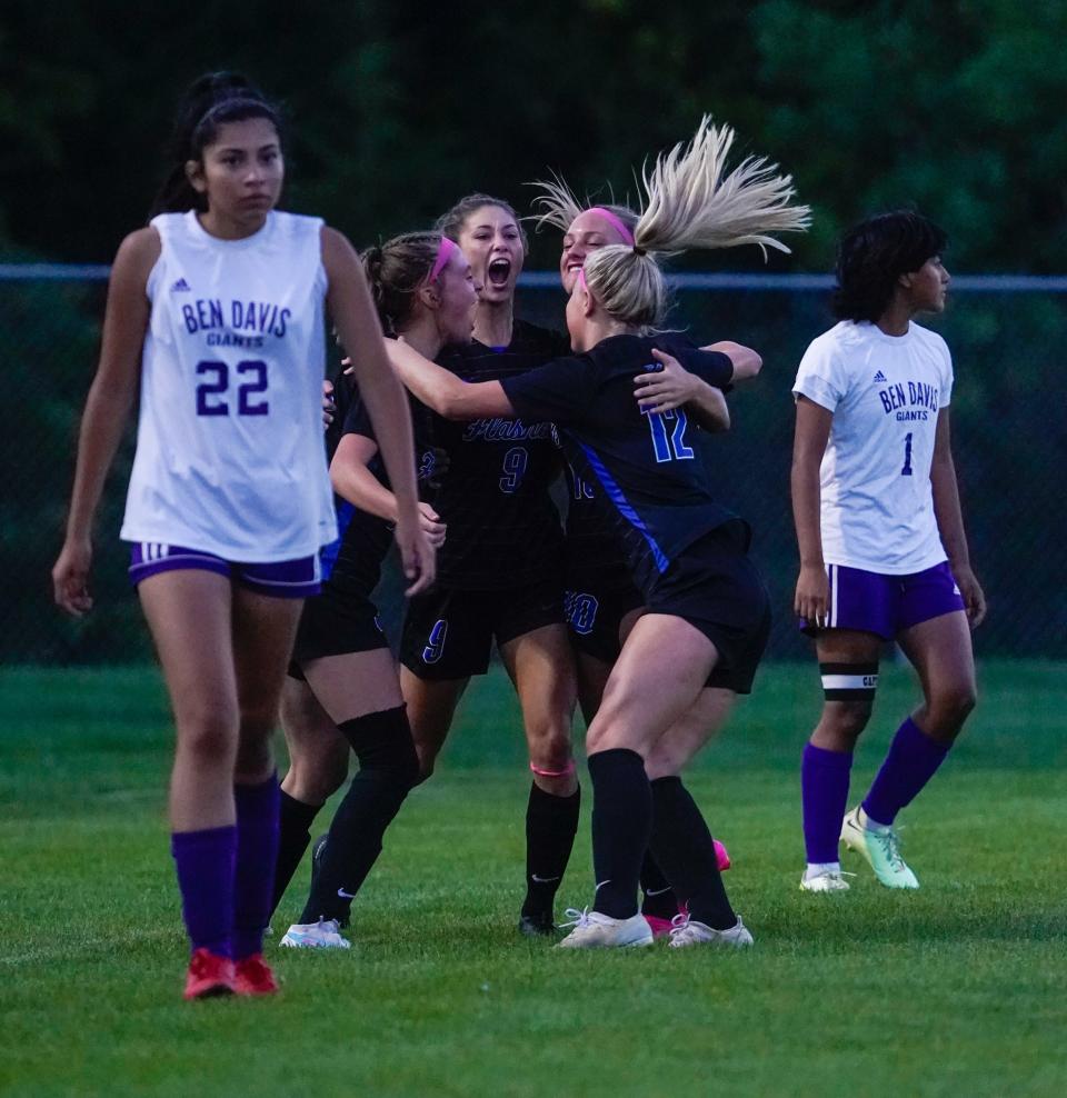 Franklin Central High School players celebrate a goal by Breece Bass (9) during a game between Franklin Central High School and Ben Davis High School on senior night at FCHS on Monday, Aug. 28, 2023, in Indianapolis.