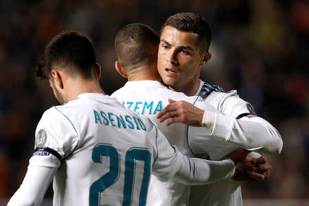 Soccer Football - Champions League - APOEL Nicosia vs Real Madrid - GSP Stadium, Nicosia, Cyprus - November 21, 2017 Real Madrid’s Karim Benzema celebrates scoring their fourth goal with Cristiano Ronaldo and Marco Asensio REUTERS/Yiannis Kourtoglou