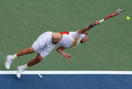 Mardy Fish serves against Feliciano Lopez of Spain during day four of the Western & Southern Open on August 14, 2012 in Mason, Ohio. Fish ousted Lopez 6-2, 6-3