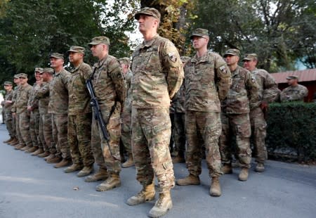 U.S. soldiers take part in a memorial ceremony to commemorate the 16th anniversary of the 9/11 attacks, in Kabul