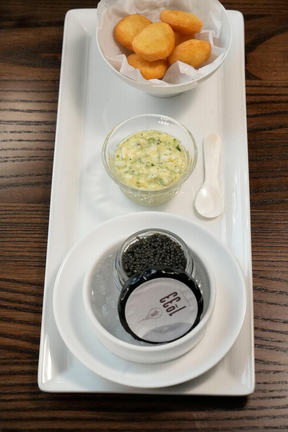 A standout on 1033's raw bar menu, the caviar is served with six bite-sized mochi doughnuts and a "special sauce."