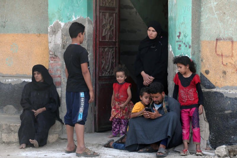 Relatives of Egyptians who died in the storm that hit Libya wait at Kafr Sharif village in Egypt on Wednesday. Photo by Khaled Elfiq/EPA-EFE