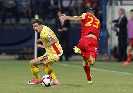 Soccer Football - 2018 World Cup Qualifications - Europe - Montenegro vs Romania - Podgorica, Montenegro - September 4, 2017 - Romania's Stancu Bogdan Sorin in action with Montenegro's Adam Marusic. REUTERS/Stevo Vasiljevic