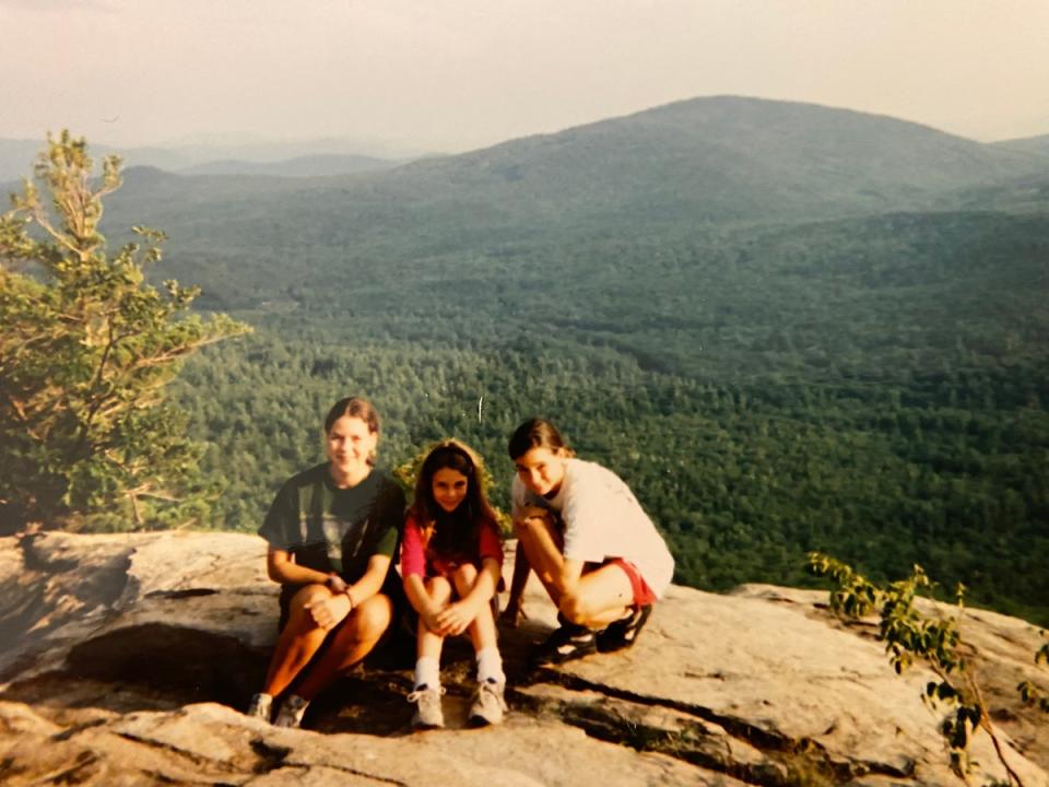 Maura Murray, left, poses in the mountains as a teen, just a few years before her baffling disappearance in New Hampshire in 2004 (Julie Murray)