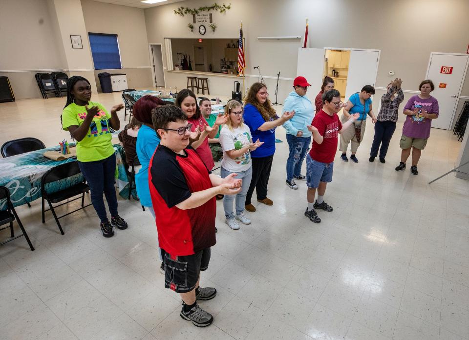 Clients in the Circle Of Friends Ministry program in Lake Wales gather on a recent afternoon. The nonprofit founded in 1999 offers a range of programs for adults with intellectual and developmental disabilities.
