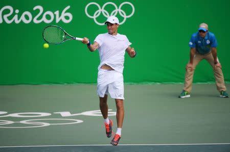 2016 Rio Olympics - Tennis - Preliminary - Men's Singles Second Round - Olympic Tennis Centre - Rio de Janeiro, Brazil - 09/08/2016. Evgeny Donskoy (RUS) of Russia in action against David Ferrer (ESP) of Spain. REUTERS/Toby Melville