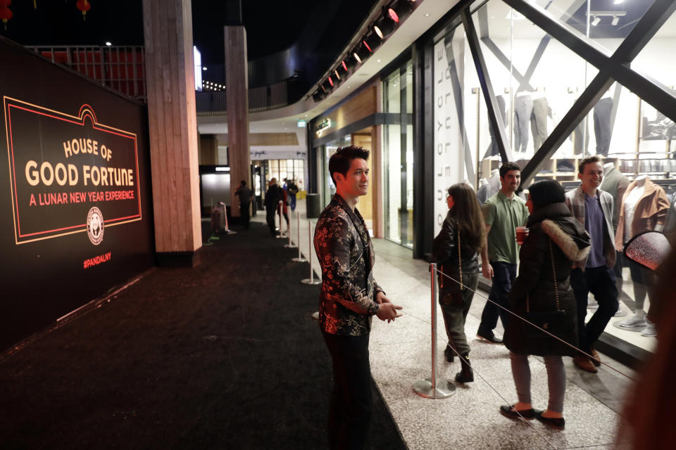 CORRECTS CITY TO LOS ANGELES - Actor Harry Shum Jr. poses for photos during the opening of a Lunar New Year installation Thursday, Jan. 31, 2019 in Los Angeles. In recent years, the Lunar or Chinese New Year, which people around the globe are ringing in Tuesday, seems to have achieved all-American status. (AP Photo/Marcio Jose Sanchez)