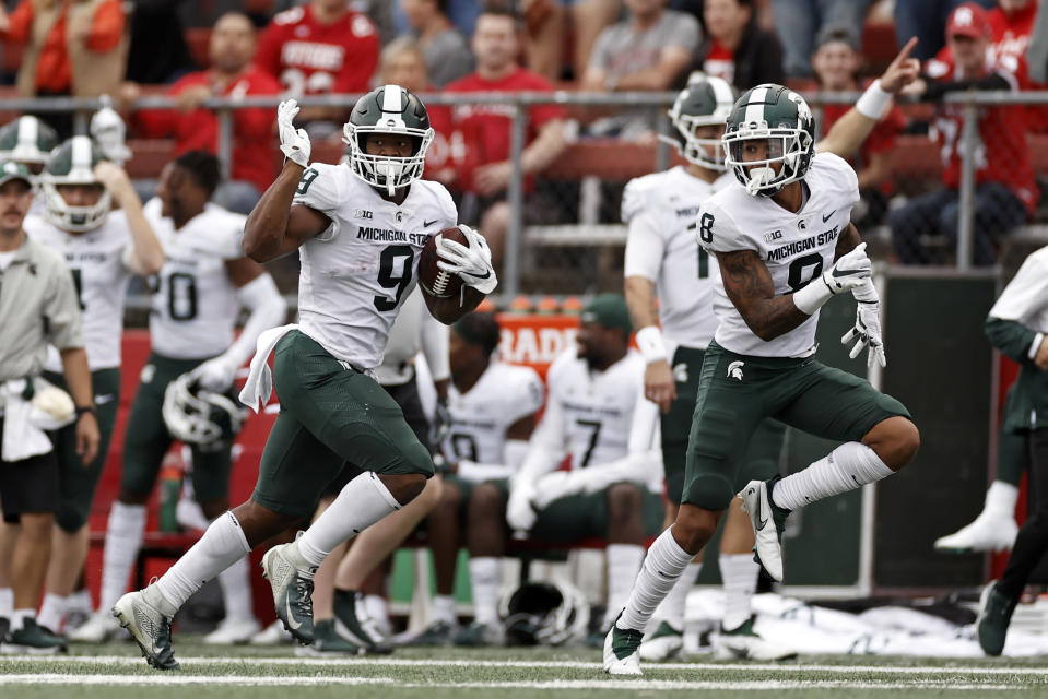 Michigan State running back Kenneth Walker III (9) runs on his way to scoring a 94-yard touchdown against Rutgers during the second half of an NCAA college football game Saturday, Oct. 9, 2021, in Piscataway, N.J. Michigan State won 31-13. (AP Photo/Adam Hunger)