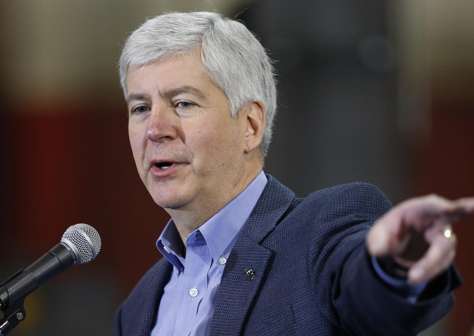 Michigan Gov. Rick Snyder speaks at the IDEAL Group Thursday, Jan. 23, 2014 in Detroit. Snyder announced a plan to ask the Obama administration to set aside thousands of work visas to entice talented immigrants to live and work in bankrupt Detroit. The Republican governor said he is seeking 50,000 work visas solely for the city over five years. (AP Photo/Paul Sancya)