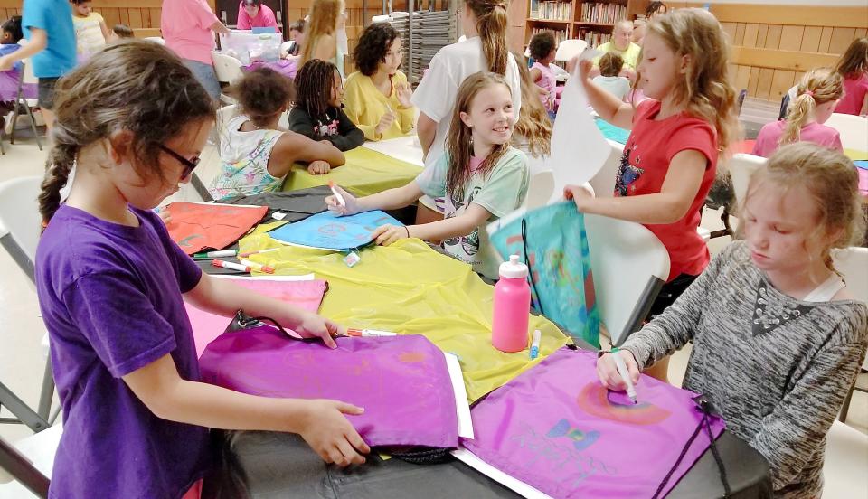 Girl Scouts design their own bags during Washington County Day Camp