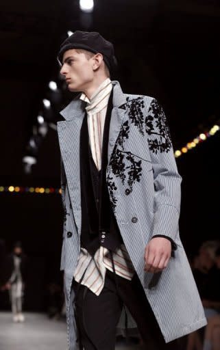 A model presents a creation for Belgian fashion designer Ann Demeulemeester during the men's ready-to-wear fashion shows on June 28, 2013 in Paris. Demeulemeester used delicate tumbling floral embroidery on jackets and trousers in multi-layered ensembles equally suited to men or women