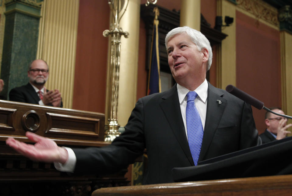 FILE - In this Jan. 23, 2018, file photo, Michigan's Republican Gov. Rick Snyder delivers his final State of the State address at the state Capitol in Lansing, Mich. On Friday, Dec. 28, 2018, Snyder signed a law making it harder for groups to put proposals on the statewide ballot and vetoed one that would have hamstrung the incoming Democratic attorney general. (AP Photo/Al Goldis, File)