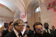 US Microsoft founder, Co-Chairman of the Bill & Melinda Gates Foundation, Bill Gates, left, and Irish rock band U2 singer Bono arrive at the City Hall of Lyon, central France, Wednesday Oct.9 2019, ahead of the two-day conference of Global Fund to Fight HIV, Tuberculosis and Malaria. (Olivier Chassignole, Pool via AP)