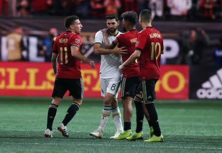 Dec 8, 2018; Atlanta, GA, USA; Atlanta United forward Josef Martinez (7) hugs Portland Timbers midfielder Diego Valeri (8) after Atlanta won in the 2018 MLS Cup championship game at Mercedes-Benz Stadium. Brett Davis-USA TODAY Sports