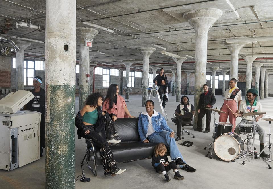 “We share information, factories, interns, models, lights, everything!” —Telfar Clemens
Clemens (seated, in denim jacket) in Brooklyn with friends, muses, and collaborators.