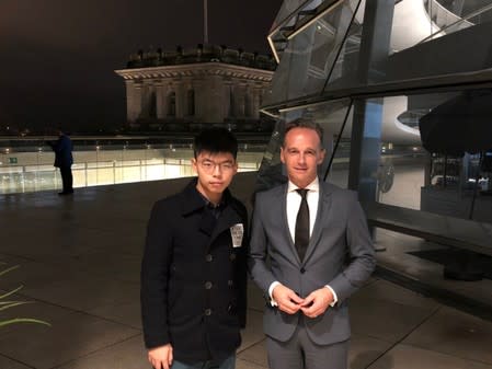 Hong Kong's activist Wong poses with German Foreign Minister Maas on top of Bundestag in Berlin