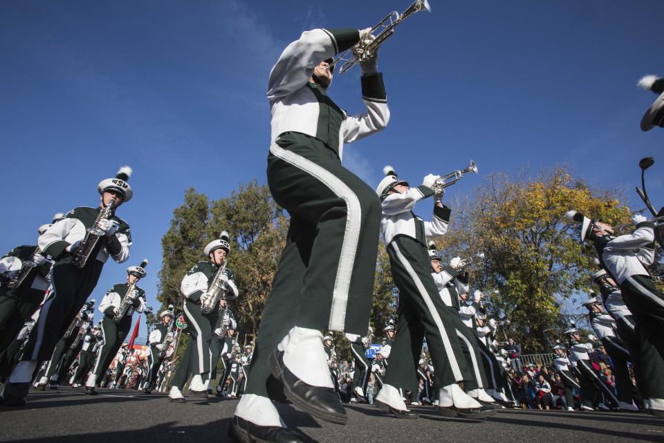 Michigan State University Spartan Marching Band performs along Colorado Boulevard during the 125th Tournament of Roses Parade in Pasadena, Calif., Wednesday, Jan. 1, 2014. (AP Photo/Ringo H.W. Chiu)