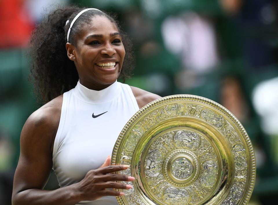 Serena Williams (pictured) poses with the winner's trophy at Wimbledon.