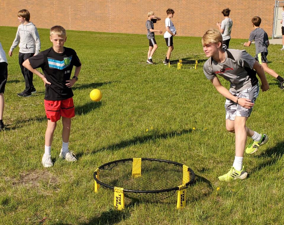 Students play some Spikeball during the Watertown Middle School Arrowfest on Friday, May 26, 2023.