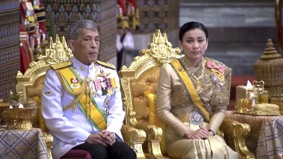 In this image made from video, Thailand’s King Maha Vajiralongkorn, left, and Queen Suthida attend the second of a three-day coronation ceremony for Thai King Maha Vajiralongkorn that includes bestowing of the royal title and granting of ranks to members of royalty at Grand Palace in Bangkok, Sunday, May 5, 2019. Thailand's King Maha Vajiralongkorn was officially crowned Saturday amid the splendor of the country's Grand Palace, taking the central role in an elaborate centuries-old royal ceremony that was last held almost seven decades ago.(Thai TV Pool via AP)