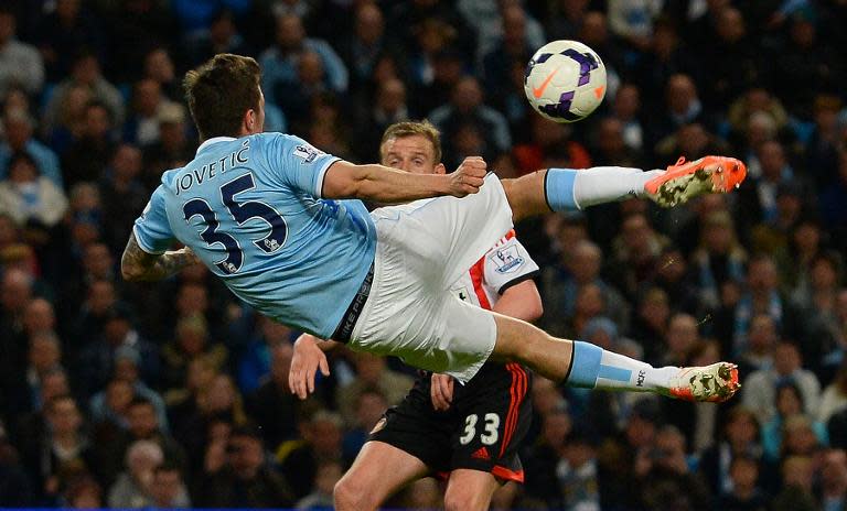 Manchester City's Stevan Jovetic attempts a scissor kick during their English Premier League match against Sunderland, at the Etihad Stadium in Manchester, on April 16, 2014
