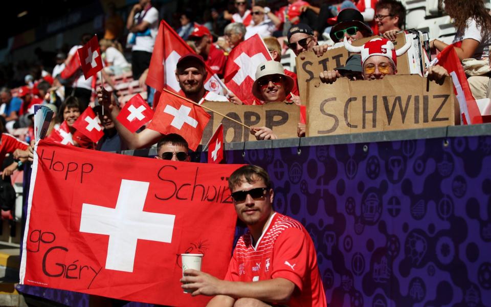 LEIGH, ENGLAND - JULY 09: Switzerland fans show their support prior to the UEFA Women's Euro 2022 group C match between Portugal and Switzerland at Leigh Sports Village on July 09, 2022 in Leigh, England. - Jan Kruger/UEFA