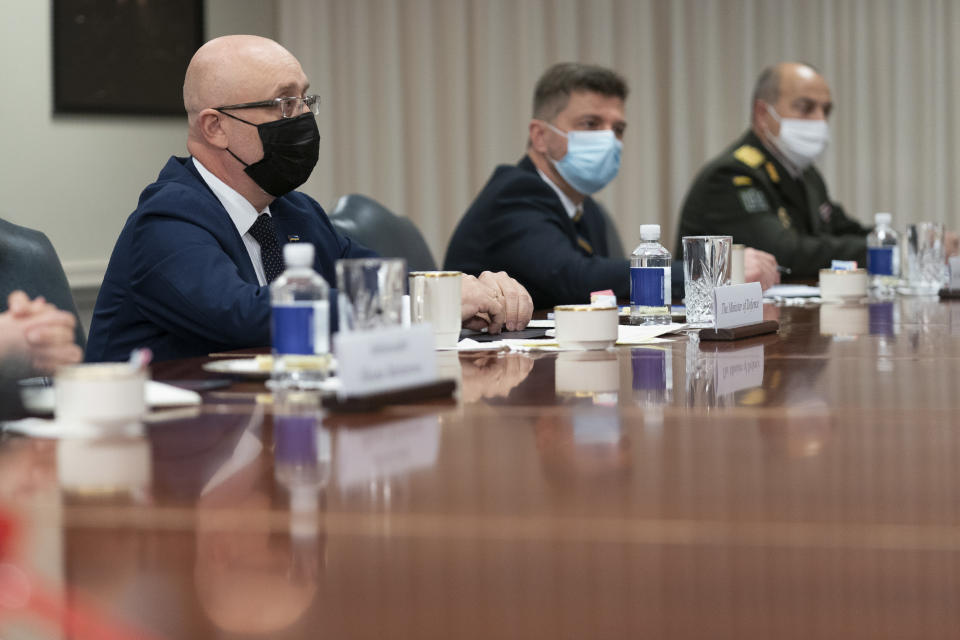 FILE - Ukrainian Defense Minister Oleksii Reznikov, left, speaks during a meeting with Defense Secretary Lloyd Austin, at the Pentagon on Nov. 18, 2021, in Washington. Ukraine’s defense minister estimates that Russia has amassed more than 94,000 troops near their borders and says there is a probability of a “large-scale escalation” in late January. Ukrainian and Western officials recently voiced alarm that a Russian troop buildup near Ukraine could herald an invasion. Moscow has denied planning to invade Ukraine and accused the West of fabricating claims to cover up its own aggressive designs. (AP Photo/Manuel Balce Ceneta, File)