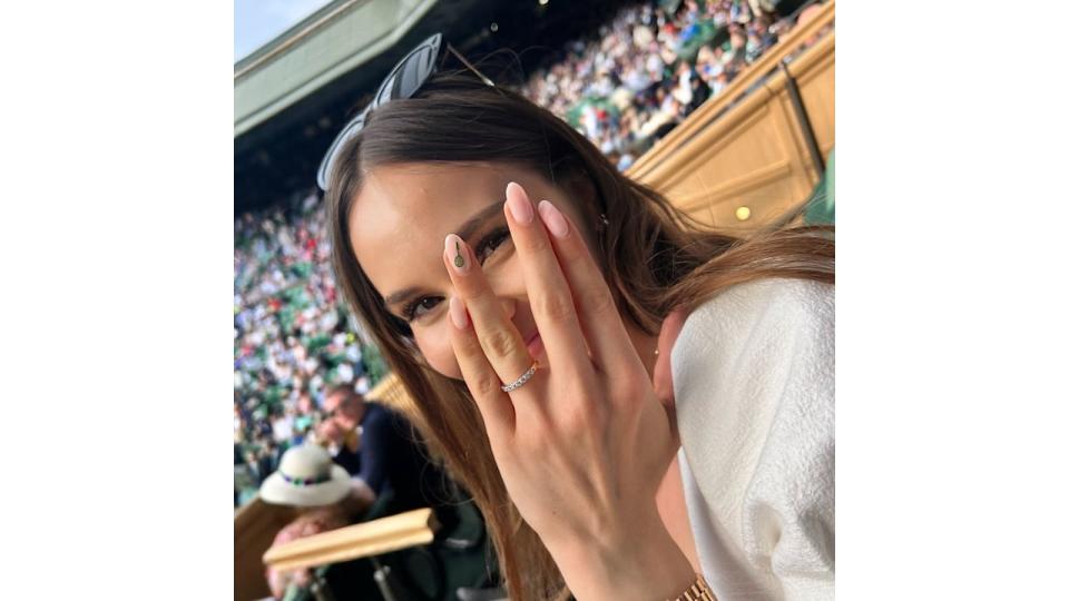 A photo of Holly Ramsay showing her hand to the camera