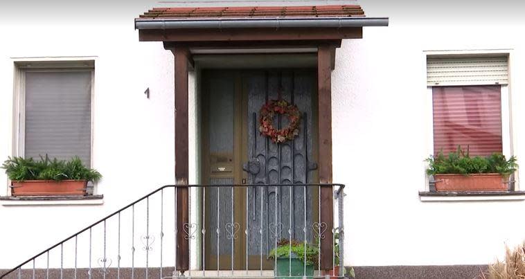 A house in the western German town of Attendorn, where a girl was rescued after allegedly being held captive by her mother and grandparents for most of her life, is seen on November 7, 2022.  / Credit: Reuters