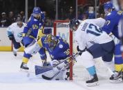 Sep 25, 2016; Toronto, Ontario, Canada; Team Sweden goalie Henrik Lundqvist (30) makes a save on Team Europe forward Marian Gaborik (12) as Team Sweden defenceman Erik Karlsson (65) looks on during the first period of a semifinal game in the 2016 World Cup of Hockey at Air Canada Centre. Mandatory Credit: John E. Sokolowski-USA TODAY Sports