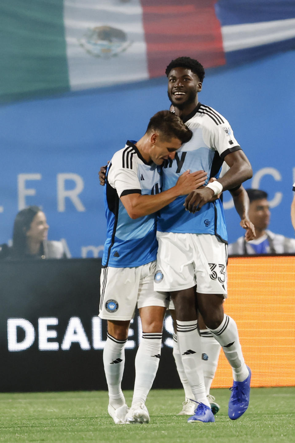 Charlotte FC forward Patrick Agyemang, right, hugs midfielder Ashley Westwood after scoring a second-half goal against Toronto FC in an MLS soccer match in Charlotte, N.C., Saturday, April 13, 2024. (AP Photo/Nell Redmond)
