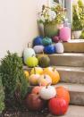 <p>If you went a little overboard at the pumpkin patch and have a lot of pumpkins to work with, try painting each one a different color to create a chic rainbow effect. </p><p><em><a href="https://thehousethatlarsbuilt.com/2018/10/diy-rainbow-pumpkins.html/" rel="nofollow noopener" target="_blank" data-ylk="slk:Get the tutorial at The House That Lars Built »;elm:context_link;itc:0;sec:content-canvas" class="link ">Get the tutorial at The House That Lars Built »</a></em></p>