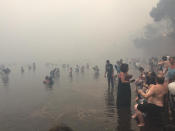 <p>People are seen as a wildfire burns in Mati, Greece July 23, 2018 in this picture obtained from social media on July 24, 2018. (Photo: Kalogerikos Nikos via Reuters) </p>