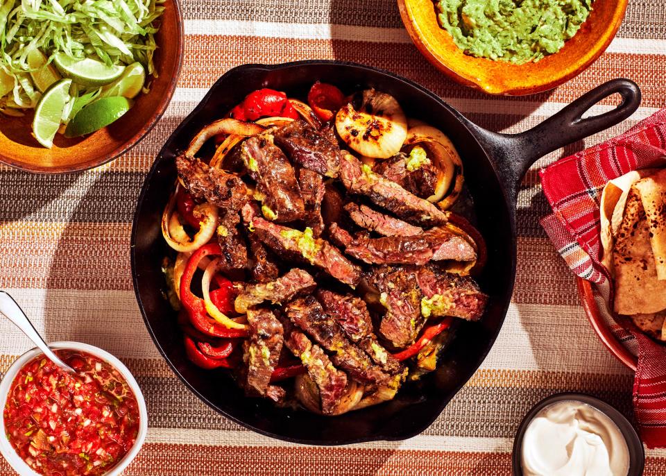 Our best steak fajitas recipe features thin strips of skirt steak, marinated in citrus and grilled over mesquite, and stuffed into warm <a href="https://www.bonappetit.com/story/best-flour-tortillas?mbid=synd_yahoo_rss" rel="nofollow noopener" target="_blank" data-ylk="slk:flour tortillas;elm:context_link;itc:0;sec:content-canvas" class="link ">flour tortillas</a>. We even included a tip on how to make them sizzle as you bring them to the table. <a href="https://www.bonappetit.com/recipe/steak-fajitas?mbid=synd_yahoo_rss" rel="nofollow noopener" target="_blank" data-ylk="slk:See recipe.;elm:context_link;itc:0;sec:content-canvas" class="link ">See recipe.</a>