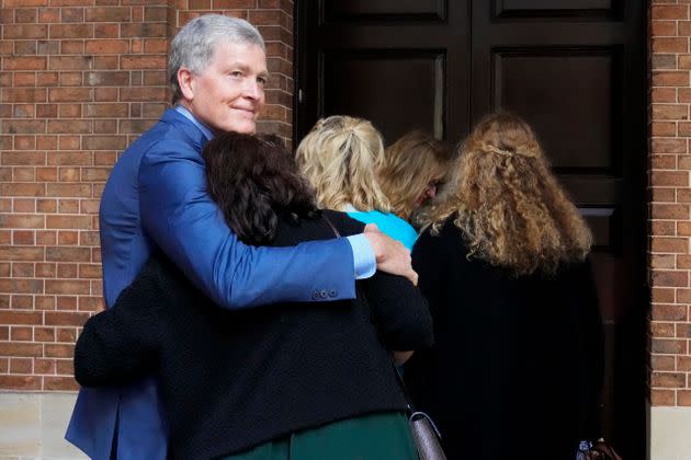 Steve Johnson hugs his wife Rosemarie. 