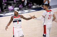 Washington Wizards guard Bradley Beal (3) and center Alex Len (27) react during the first half of an NBA basketball game against the Denver Nuggets, Wednesday, Feb. 17, 2021, in Washington. (AP Photo/Nick Wass)