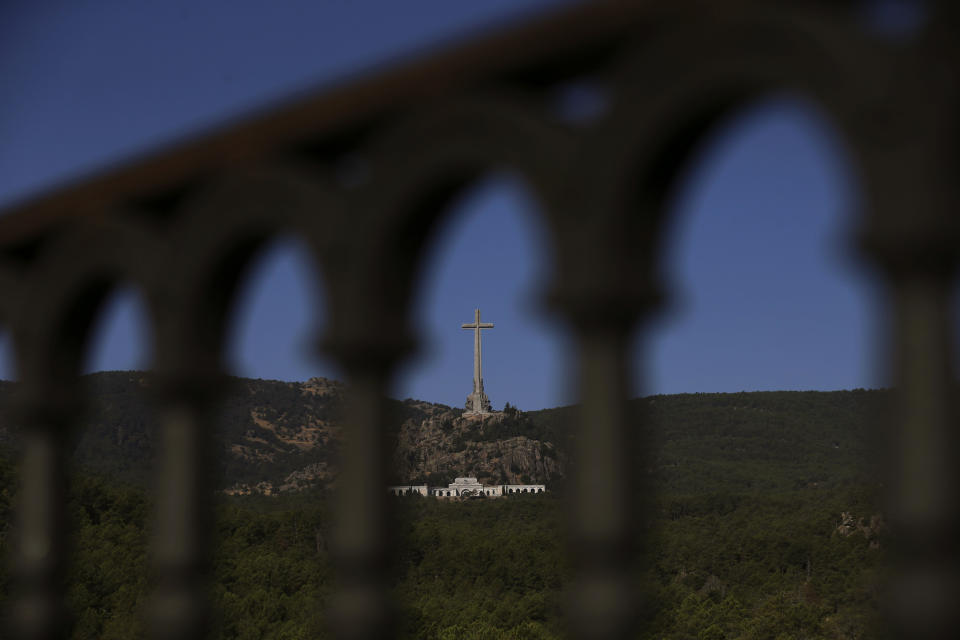 The Valley of the Fallen monument is seen at El Escorial Madrid, Friday, Aug. 24, 2018. Spain's center-left government has approved legal amendments that it says will ensure the remains of former dictator Gen. Francisco Franco can soon be dug up and removed from a controversial mausoleum. (AP Photo/Andrea Comas)