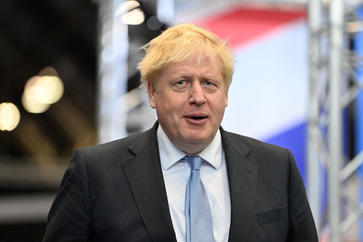 Britain's Prime Minister Boris Johnson visits the exhibition hall to try means of green transportation on the third day of the annual Conservative Party Conference at the Manchester Central convention centre in Manchester, northwest England, on October 5, 2021. (Photo by Paul ELLIS / AFP) (Photo by PAUL ELLIS/AFP via Getty Images)