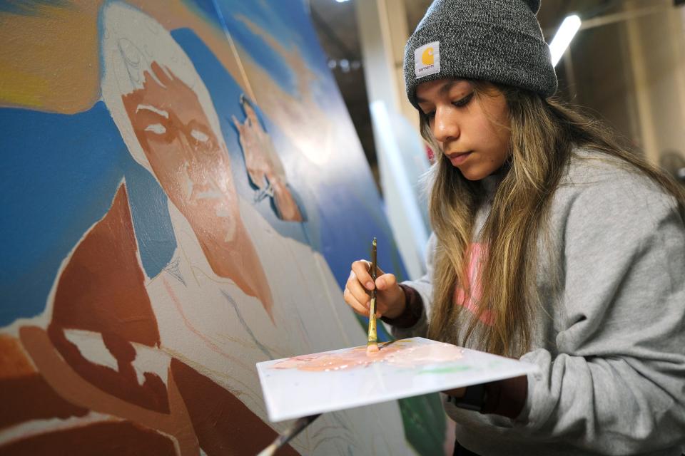Nayelly Morales Rojo works on her mural for this year's Fresh Paint: OKC NYE Mural Project at the OKC Farmers Public Market Monday, November 7, 2022.