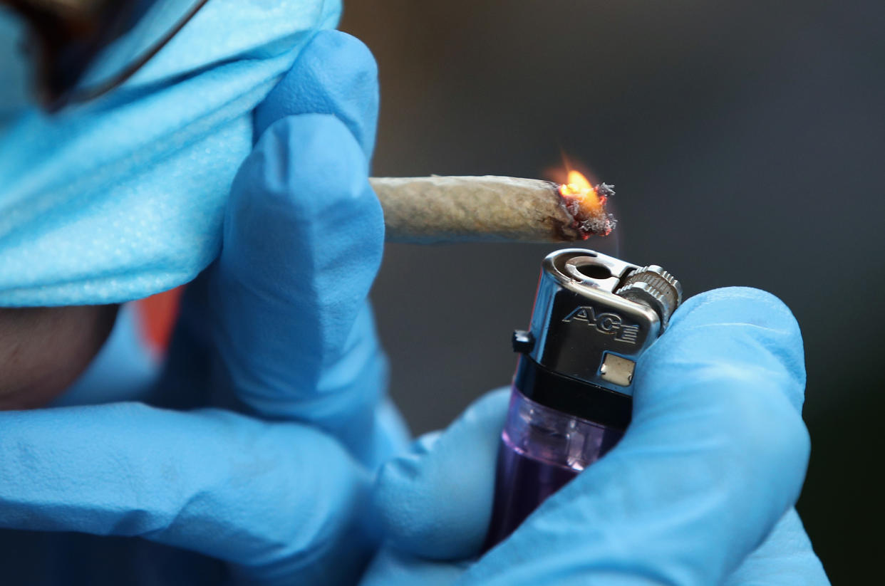 BROOKLYN, NEW YORK  - APRIL 14: A recreational marijuana smoker indulges in smoking weed on April 14, 2020 in the Bushwick section of the Brooklyn borough of New York City. As some smokers turn to smoking weed to ease their stress during the coronavirus pandemic, some doctors are warning that cannabis can cause airway inflammation that could cause complications should a user become a victim of COVID-19. (Photo by Bruce Bennett/Getty Images)