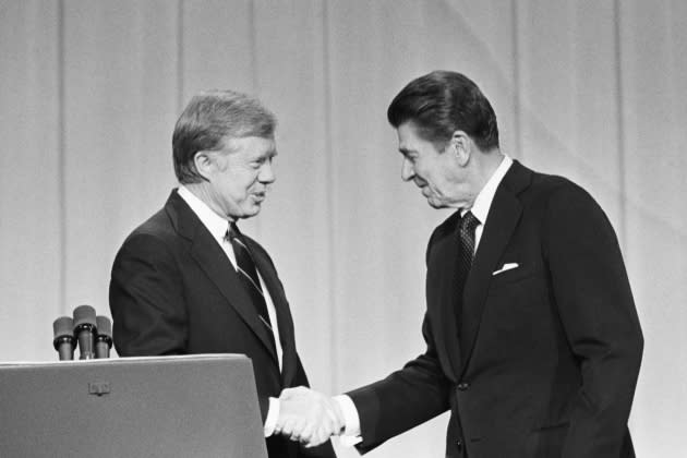 President Carter and Ronald Reagan Shake Hands During Debates - Credit: Bettmann Archive/Getty Images