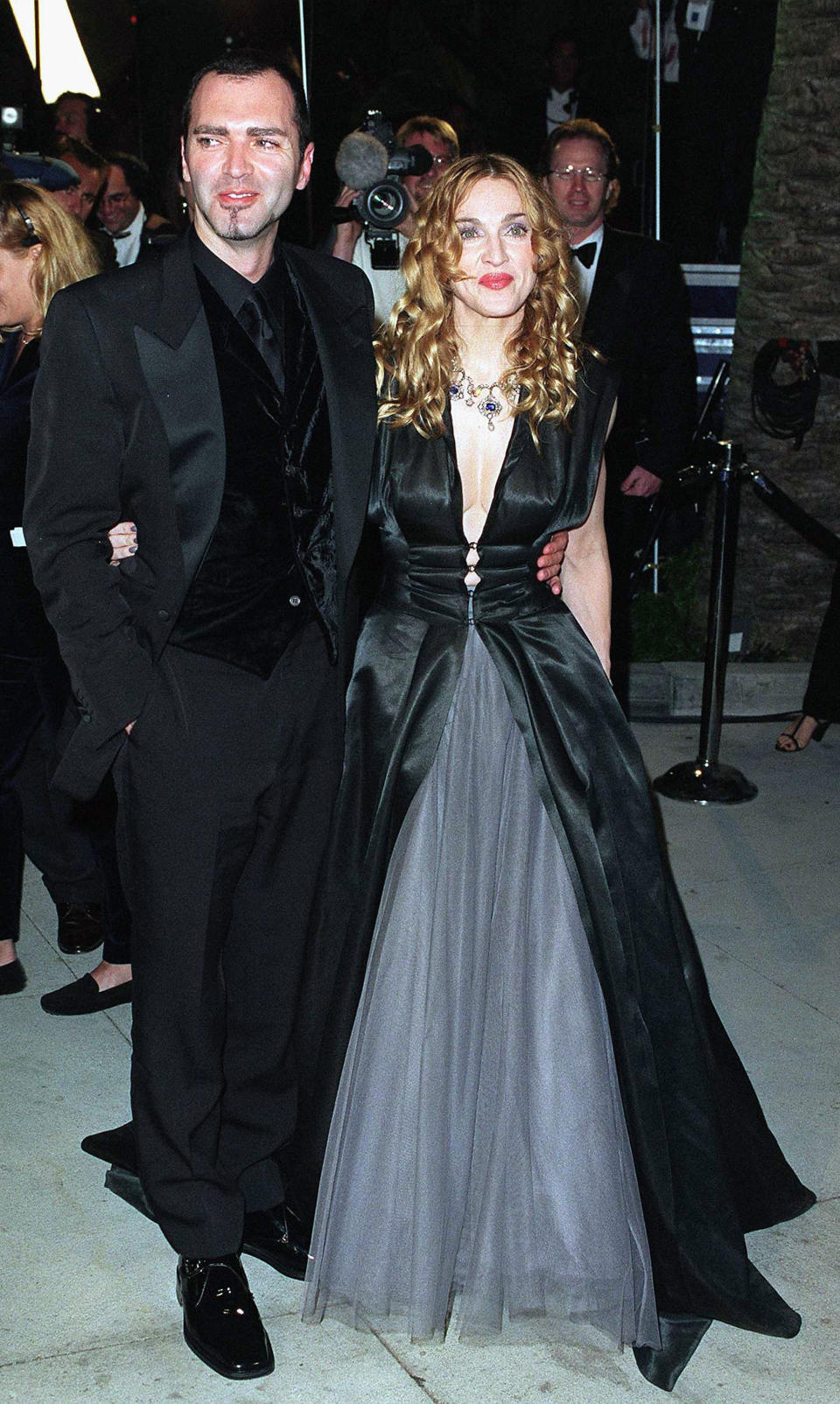 Madonna (with her brother Christopher Ciccone) at the Vanity Fair Oscar party on March 23&nbsp;in West Hollywood. She wore <a href="https://www.carmenbusquets.com/journal/post/olivier-theyskens-exhibition" target="_blank" rel="noopener noreferrer">a gown by designer Olivier Theyskens</a>, which helped boost his fame in the fashion industry.