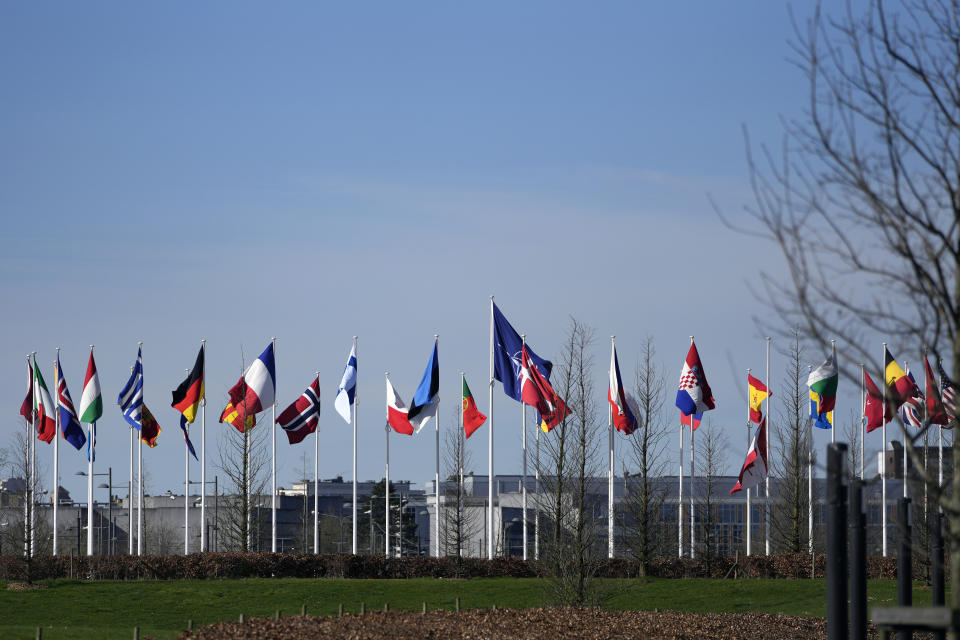 FILE - Flags of NATO member countries blow in the wind outside at NATO headquarters in Brussels, March 14, 2024. A survey of people in 13 of the nations belonging to NATO found about 6 in 10 of them held a favorable view of the Western military alliance, the Pew Research Center said Tuesday, July 2. (AP Photo/Virginia Mayo)