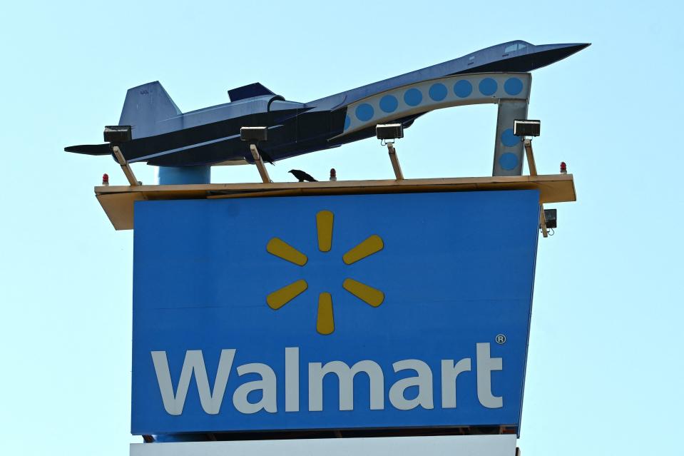 The Walmart logo is seen outside a Walmart store in Burbank, California on August 15, 2022. - Walmart, the largest retailer the United States, will report second quarter earnings on August 16, 2022. (Photo by Robyn Beck / AFP) (Photo by ROBYN BECK/AFP via Getty Images)