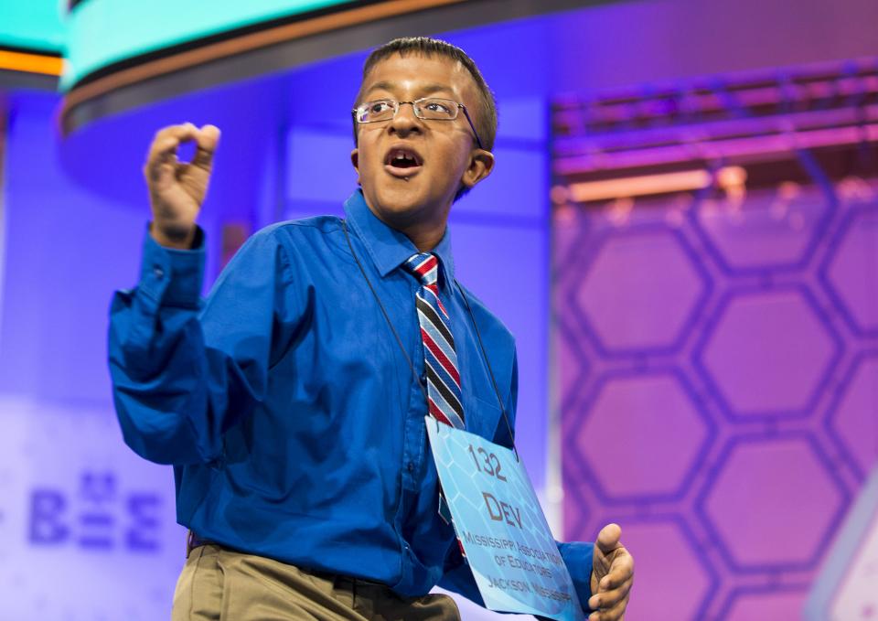 Dev Jaiswal, of Jackson, Mississippi, reacts to spelling the word "bacchius" during the final round of the 88th annual Scripps National Spelling Bee