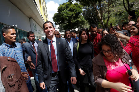 Venezuelan opposition leader Juan Guaido leaves after a meeting with representatives of FEDEAGRO, the Confederation of Associations of Agricultural Producers of Venezuela, in Caracas, Venezuela February 6, 2019. REUTERS/Carlos Garcia Rawlins